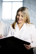 A business lady showing satisfaction while writing