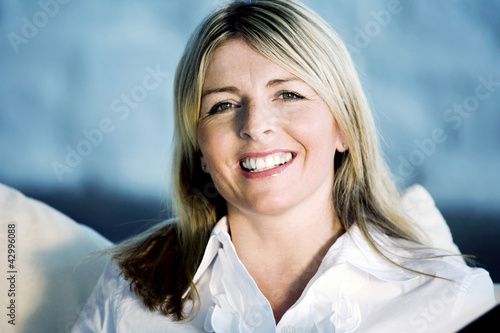 Photo: A business lady smiling at the camera A business lady smiling at the camera