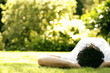 Man listening to music on the headphones while lying on the field