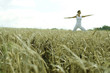 Woman practicing yoga on the field