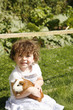 Young girl hugging a guinea pig