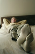 Businessman lying on the bed sleeping