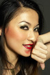 Photo: Woman rubbing off her lipstick with her hand Woman rubbing off her lipstick with her hand