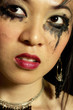 Photo: Woman with smudged mascara around her eyes Woman with smudged mascara around her eyes