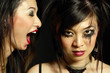 Photo: Woman with smudged lipstick screaming at another woman with smudged mascara Woman with smudged lipstick screaming at another woman with smudged mascara