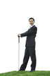 Businessman posing with golf club