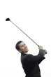 Businessman swinging golf club