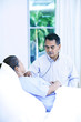Doctor and patient in ward