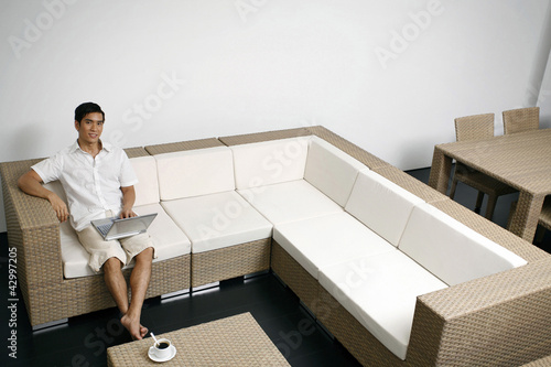 Photo: Man using laptop Man using laptop