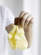 Father holding baby socks