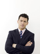 Businessman with hands across chest