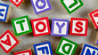 Wooden blocks forming the word TOYS in the center