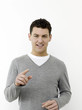 Man smiling and pointing at camera