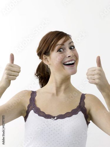 Photo: Happy woman showing double thumbs up Happy woman showing double thumbs up