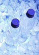 Bottled water with ice cubes