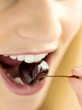 Pretty girl eating a cherry