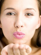 Woman blowing kiss