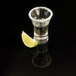 Shot of tequila with salt rim and lime