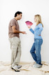 Couple choosing suitable colour from the colour chart