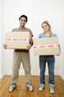 Couple carrying boxes