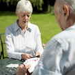 Senior couple playing cards