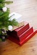 Gifts piled under Christmas tree