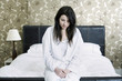 A sick woman in her bedroom
