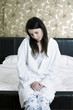Unhealthy woman in the bedroom