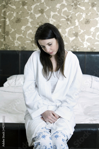 Photo: Unhealthy woman in the bedroom Unhealthy woman in the bedroom