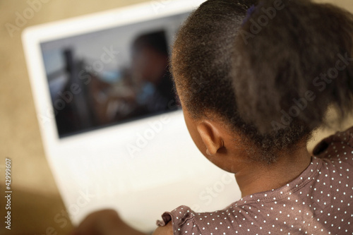 Photo: Girl using laptop Girl using laptop