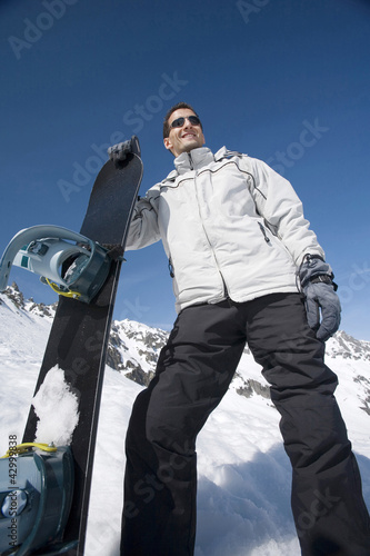 Photo: Man posing with snowboard Man posing with snowboard