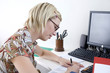 Woman working at a desk in a home office