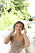 Woman listening to music on headphones