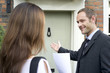 Businessman allowing businesswoman to walk before him