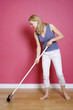 Woman sweeping the floor