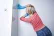 Woman cleaning the bathroom floor