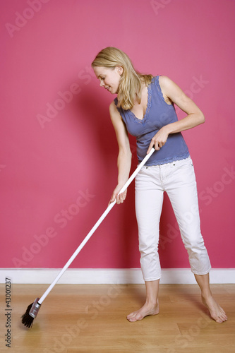 Photo: Woman sweeping the floor Woman sweeping the floor
