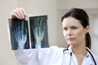 Female doctor looking at x-ray