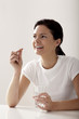 Woman about to take her medication