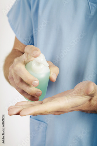 Photo: Male doctor washing his hands Male doctor washing his hands