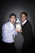 Businessman and businesswoman posing with a giant milk bottle