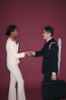 Businessman and businesswoman shaking hands
