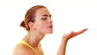 Video: Young woman blowing something from her hand Young woman blowing something from her hand