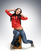 Photo: Young beautiful girl in headphones with speaker Young beautiful girl in headphones with speaker