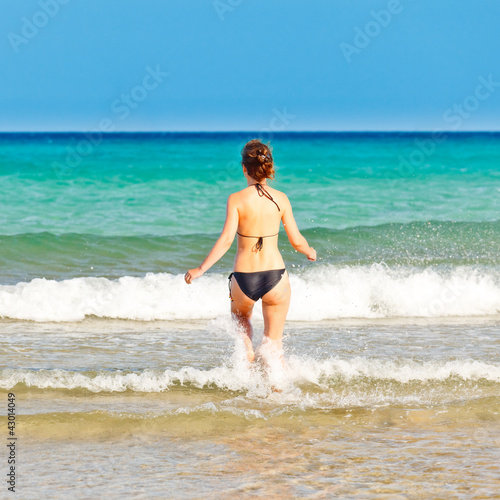 Photo: Young woman on the beach Young woman on the beach