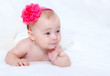 Portrait newborn baby lying in bed