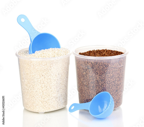 Photo: Measuring spoons and plastic containers with grain isolated Measuring spoons and plastic containers with grain isolated