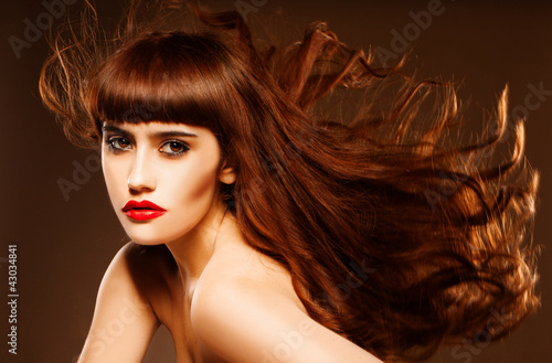 Photo: Sultry redhead with hair flying Sultry redhead with hair flying