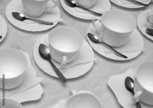 Photo: Plastic cups and saucers with spoons Plastic cups and saucers with spoons