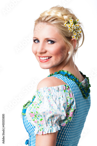 Photo: junge blonde Frau im Dirndl, über die Schulter schauend junge blonde Frau im Dirndl, über die Schulter schauend